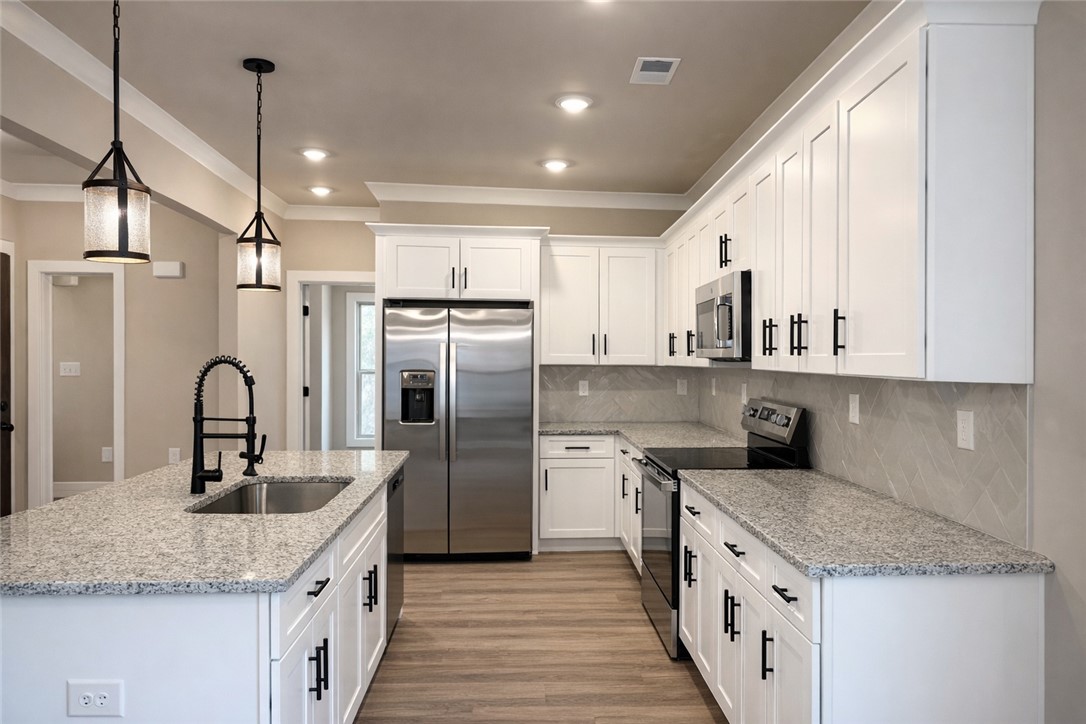 111 Birch Court Westminster, SC 29693 - Photo 7 of 27 This bright kitchen features sleek appliances and ample counter space.