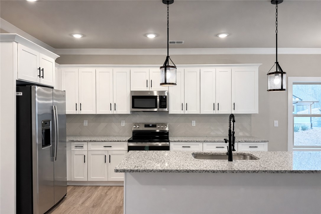 111 Birch Court Westminster, SC 29693 - Photo 8 of 27 This bright kitchen features ample counter space and modern appliances, perfect for everyday living.