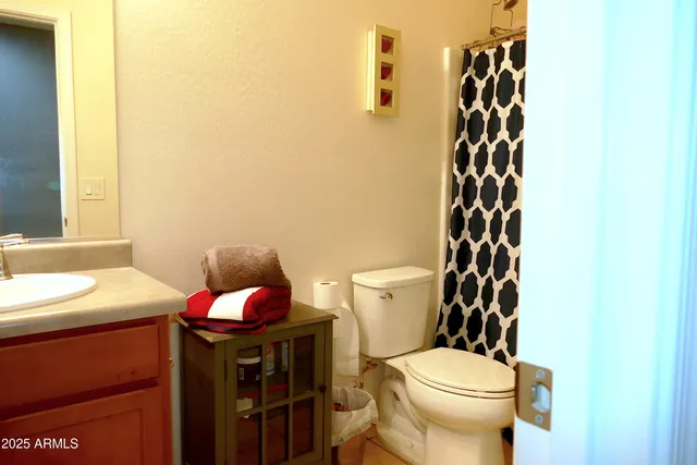 a view of a livingroom with furniture and a flat screen tv