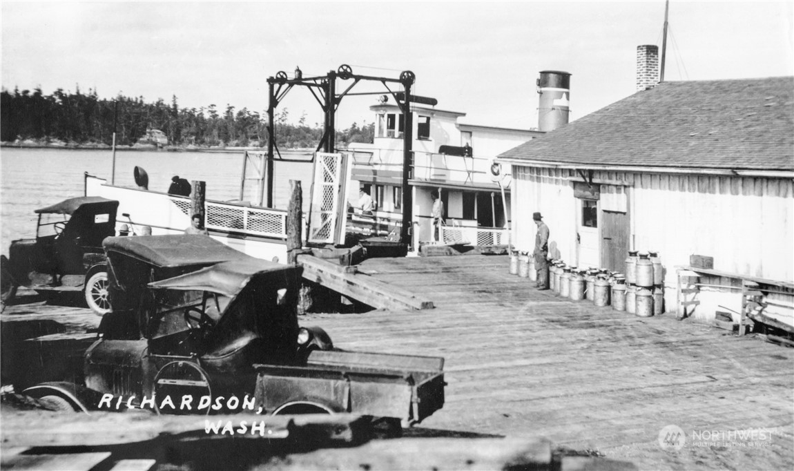 1996 Richardson Road Lopez Island, WA 98261 - Photo 15 of 16 a view of a patio with table and chairs with plants and palm trees