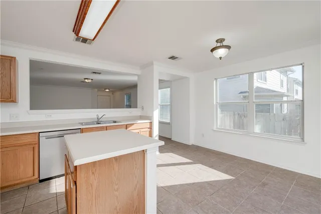 a kitchen with stainless steel appliances a stove and a refrigerator