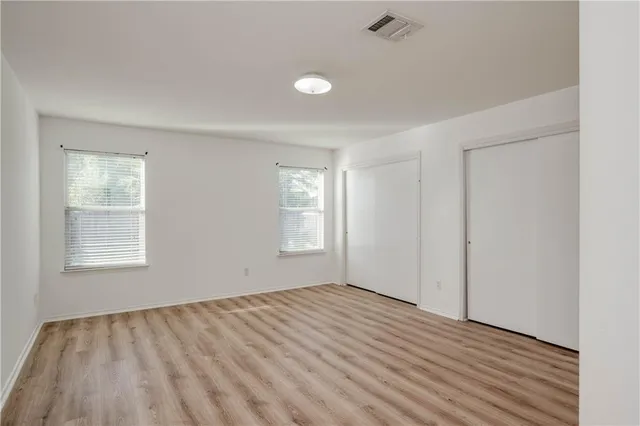 an empty room with windows