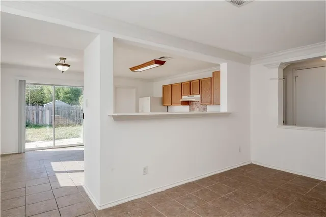 a view of an empty room and window
