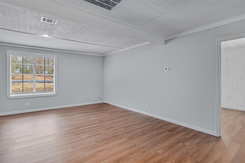 4340 Pruett Road Shreveport, LA 71107 - Photo 9 of 24 a view of an empty room with wooden floor and a window
