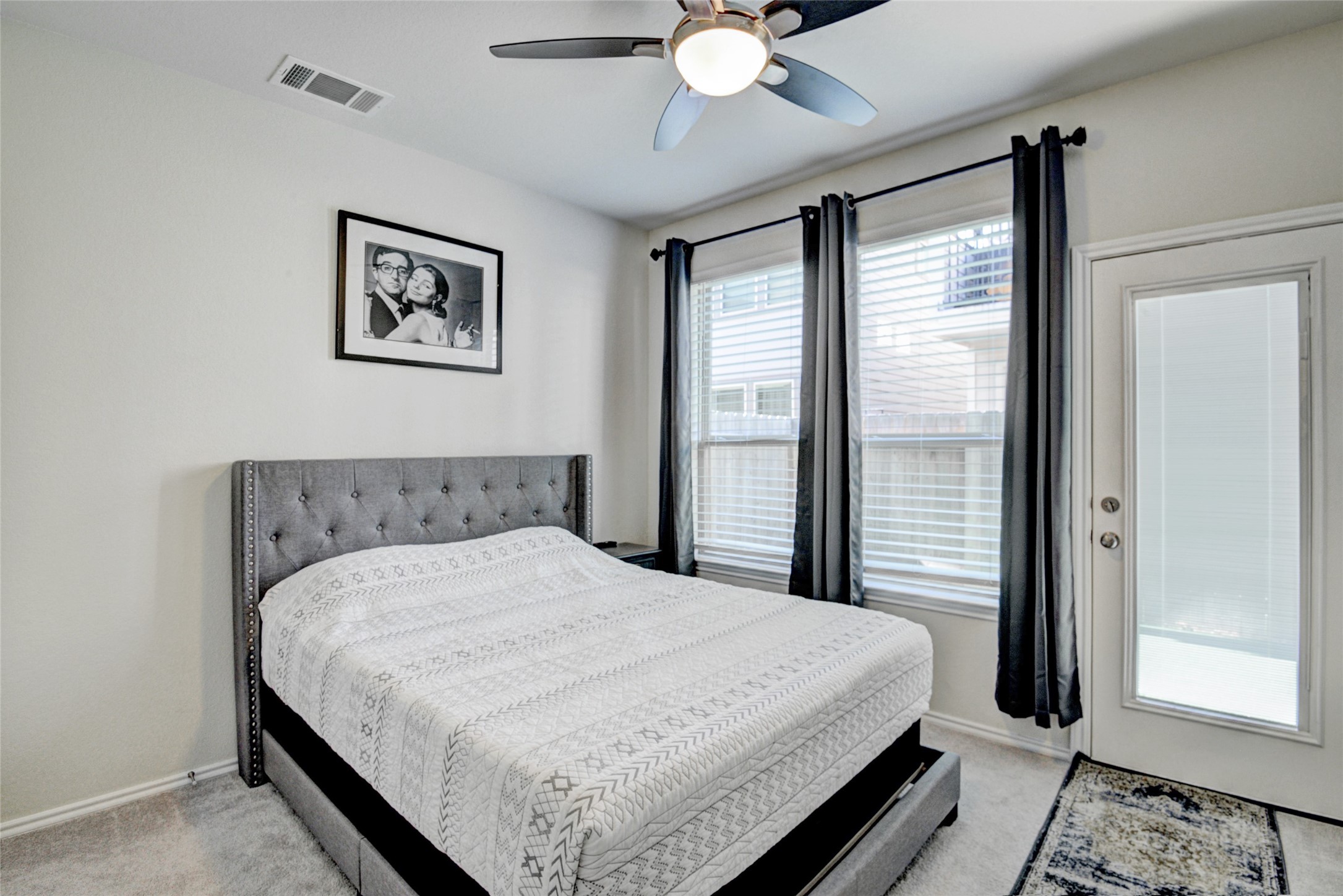 3104 Roseland Terrace Lane Houston, TX 77063 - Photo 12 of 14 a bedroom with a large bed and a chandelier