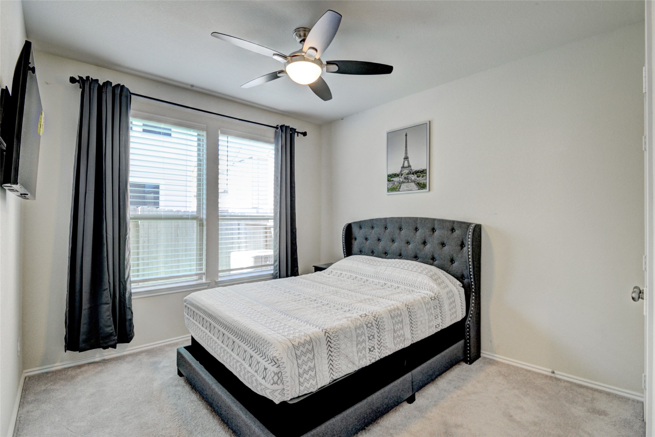 3104 Roseland Terrace Lane Houston, TX 77063 - Photo 13 of 14 a large bed sitting in a bedroom next to a window