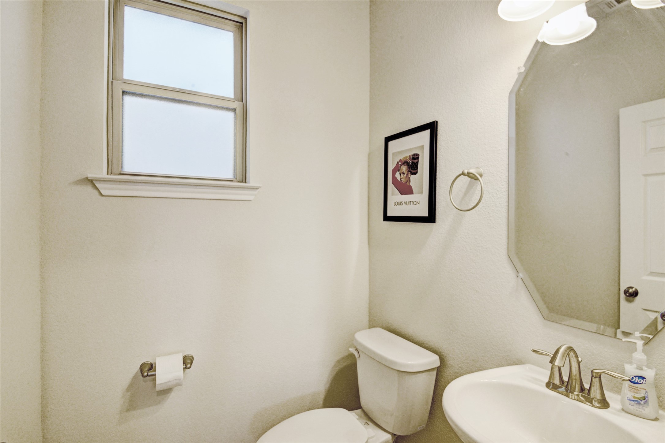 3104 Roseland Terrace Lane Houston, TX 77063 - Photo 8 of 14 a bathroom with a toilet sink vanity and mirror