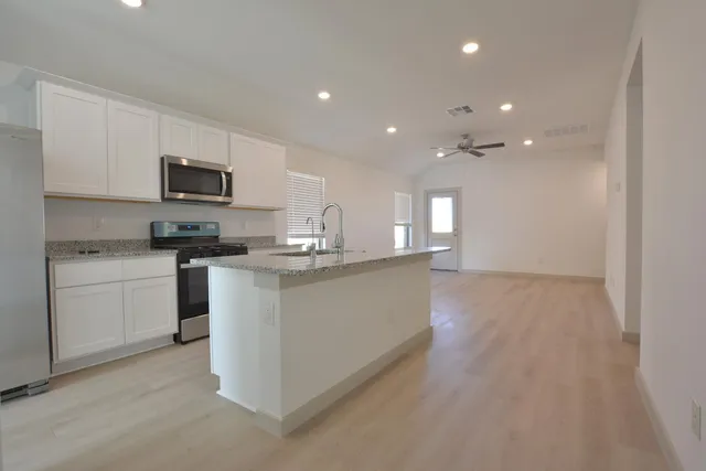 a large kitchen with cabinets