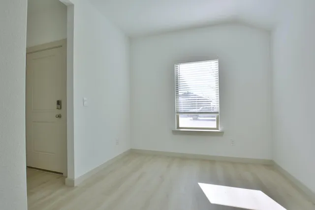 a view of a room that has a window in it