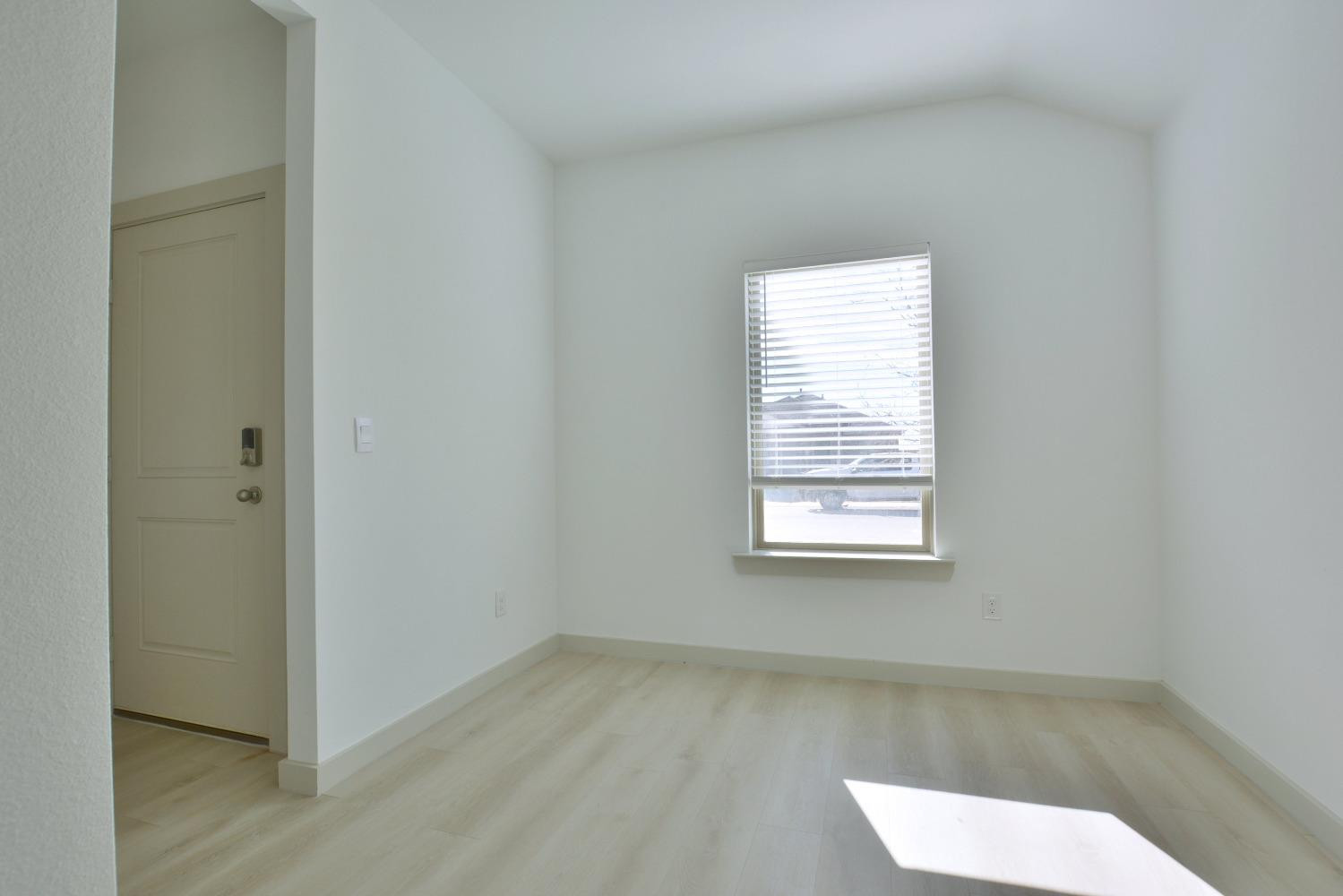 7438 8th Street Lubbock, TX 79416 - Photo 9 of 18 a view of a room that has a window in it