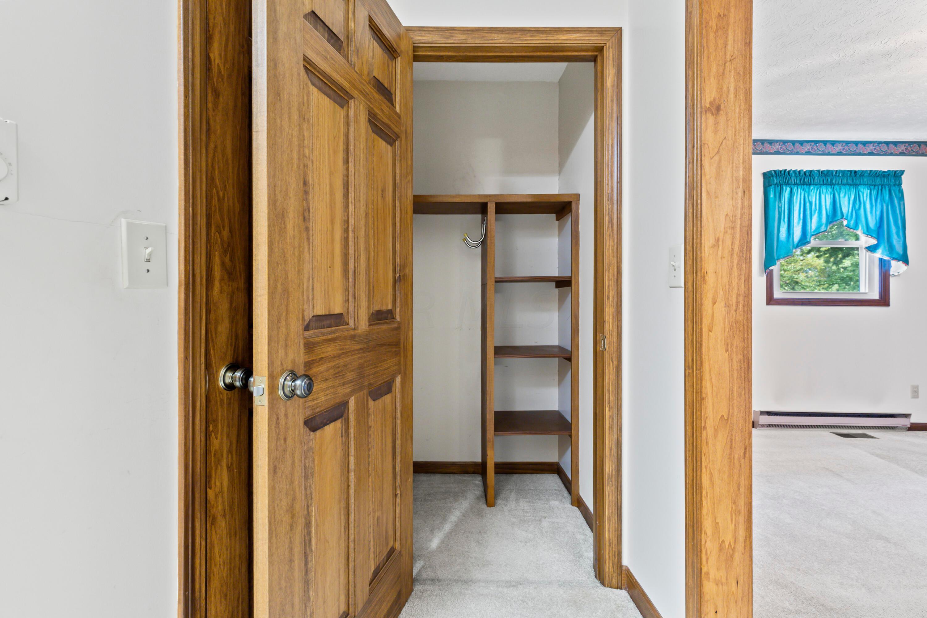 5764 Cheshire Road Galena, OH 43021 - Photo 16 of 59 • Light sand carpet
• Tan painted walls
• Ceiling light
• Shelves