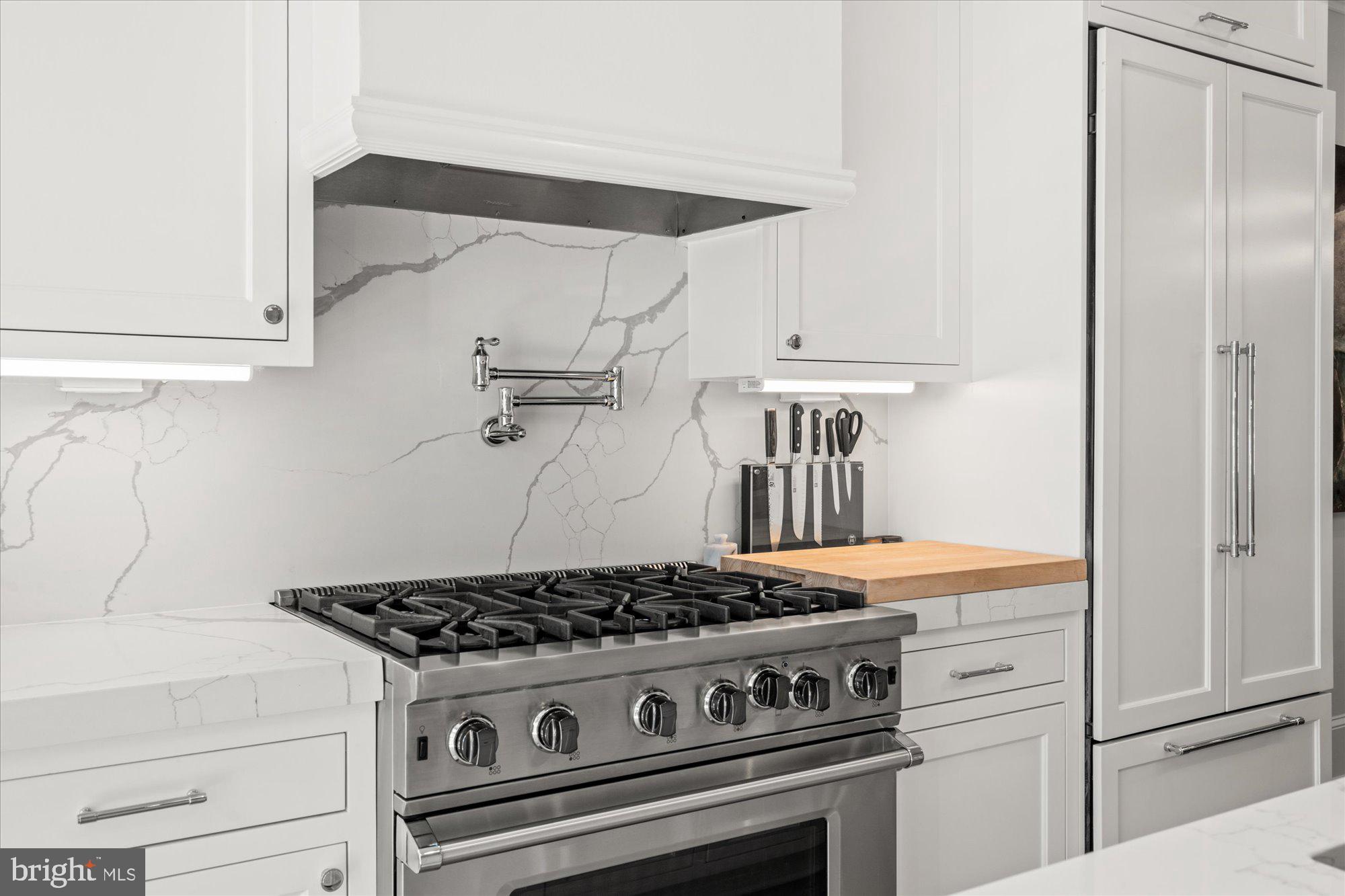 2610 Garfield Street Northwest Washington, DC 20008 - Photo 15 of 51 a stove top oven sitting inside of a kitchen