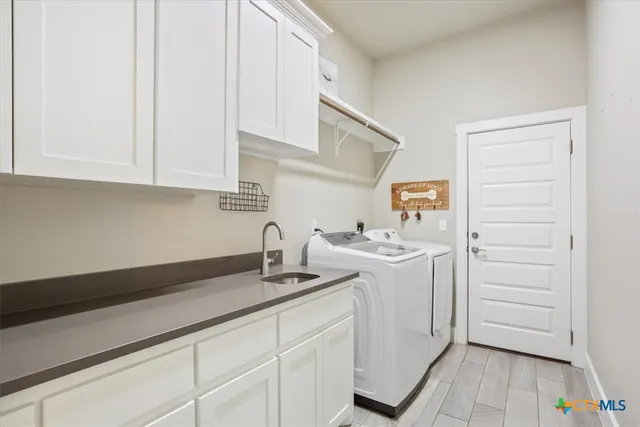 a kitchen with a sink and cabinets