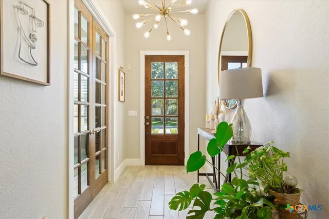 a view of an entryway with wooden floor