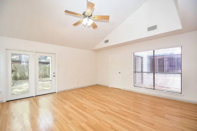a view of an empty room with a window