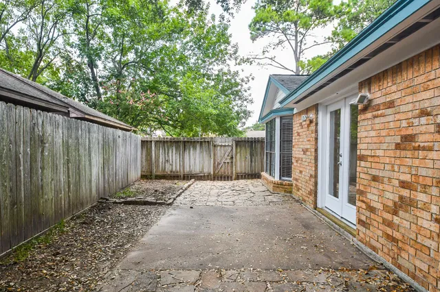 a backyard of a house with lots of green space