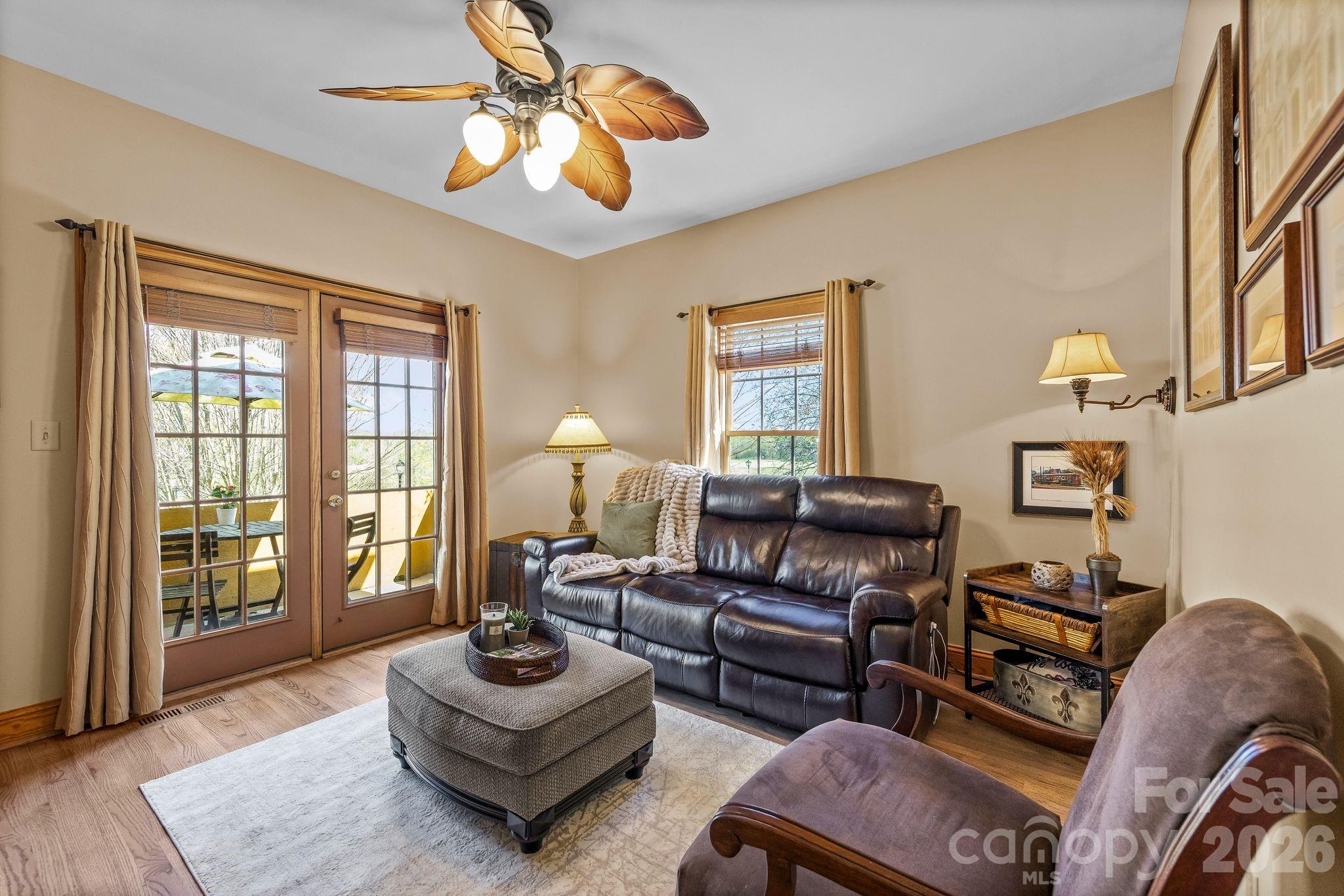 3530 Cardiff Lane Matthews, NC 28104 - Photo 25 of 39 a living room with furniture and wooden floor