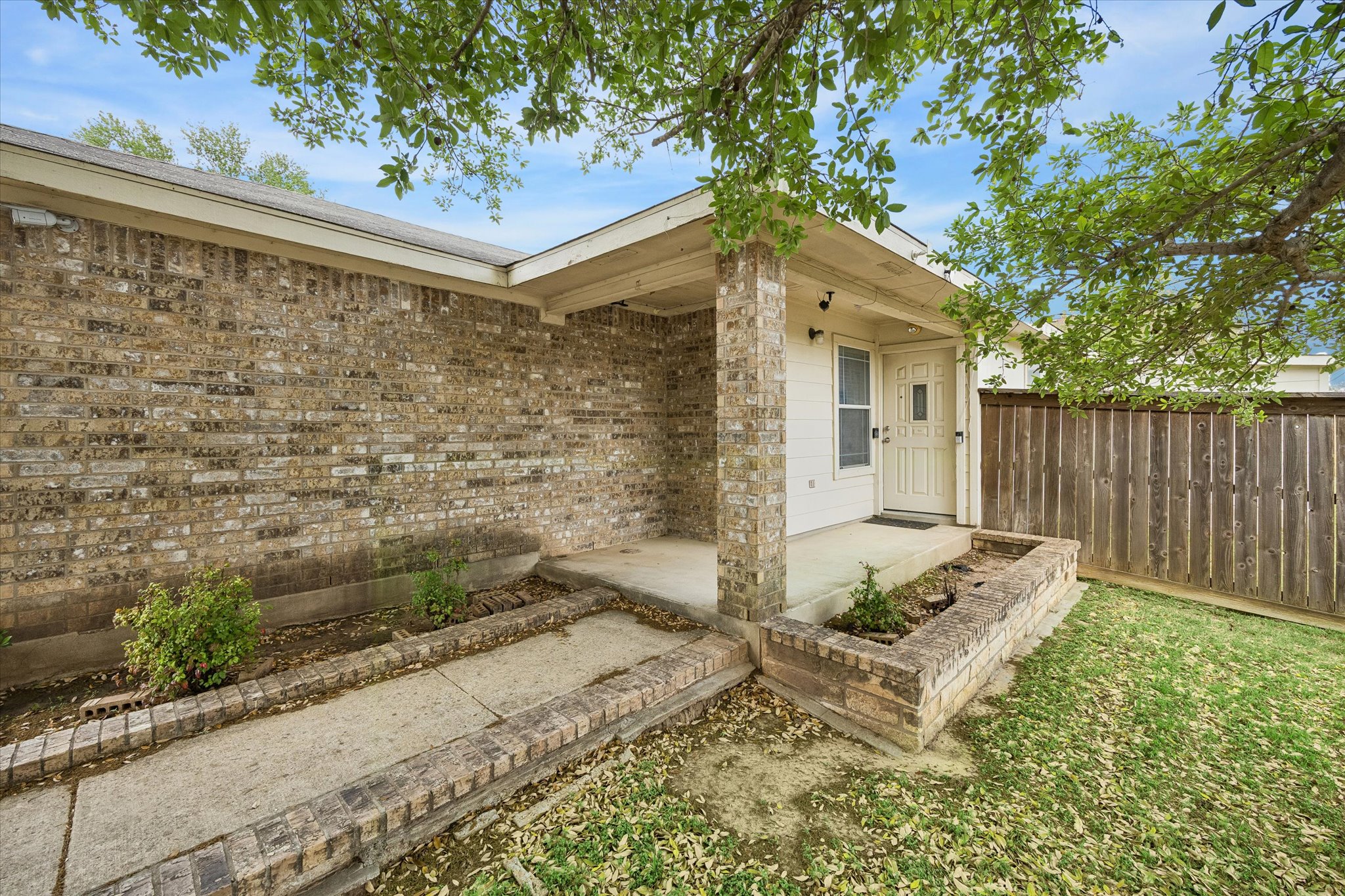 14410 Sandifer Street Austin, TX 78725 - Photo 2 of 10 a backyard of a house with table and chairs