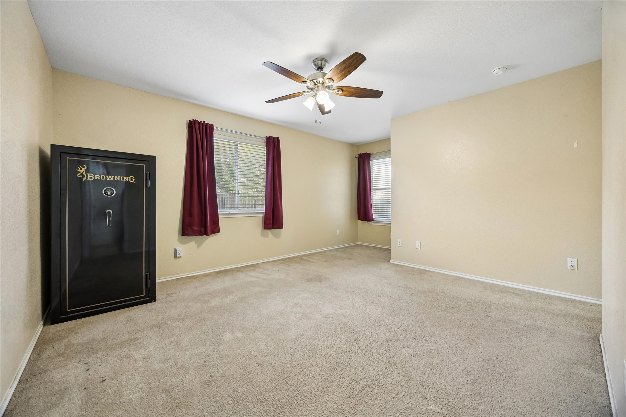 14410 Sandifer Street Austin, TX 78725 - Photo 6 of 10 an empty room with windows and fan