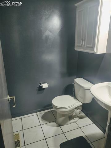 423 Ridge Road Divide, CO 80814 - Photo 34 of 48 Bathroom featuring toilet and tile patterned flooring