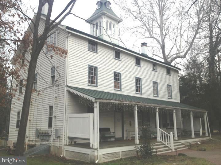 1 Breakneck Road, Unit 4 Medford, NJ 08055 - Photo 2 of 8 a view of a white house with large windows