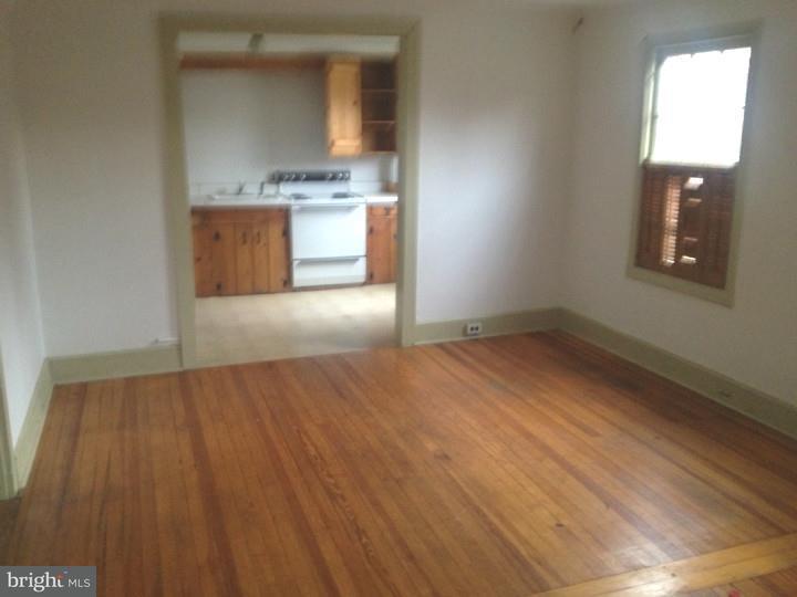 1 Breakneck Road, Unit 4 Medford, NJ 08055 - Photo 3 of 8 an empty room with wooden floor and windows