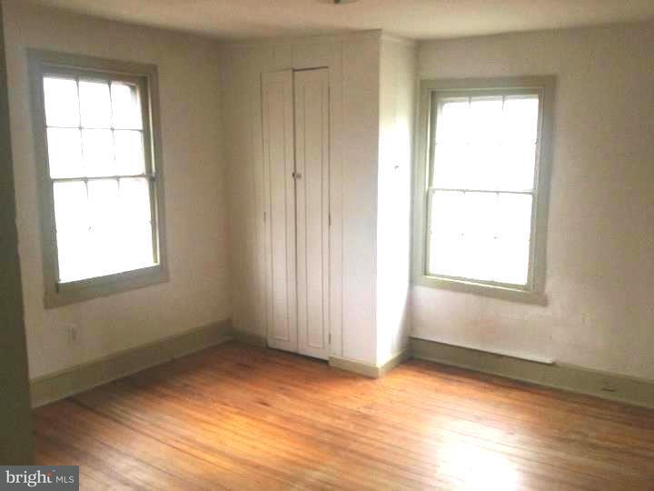 1 Breakneck Road, Unit 4 Medford, NJ 08055 - Photo 7 of 8 an empty room with wooden floor and windows