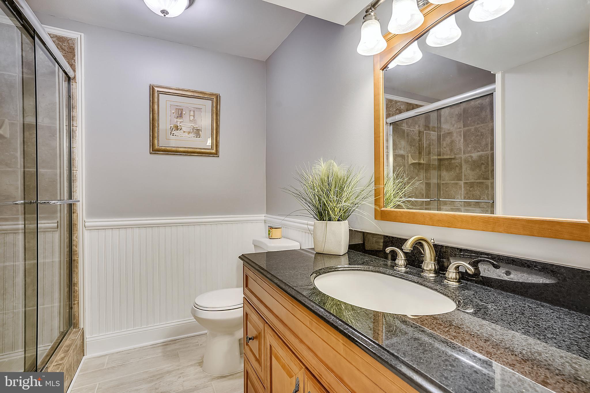 4522 Gilbertson Road Fairfax, VA 22032 - Photo 31 of 65 LL full bath with granite counters and tile shower