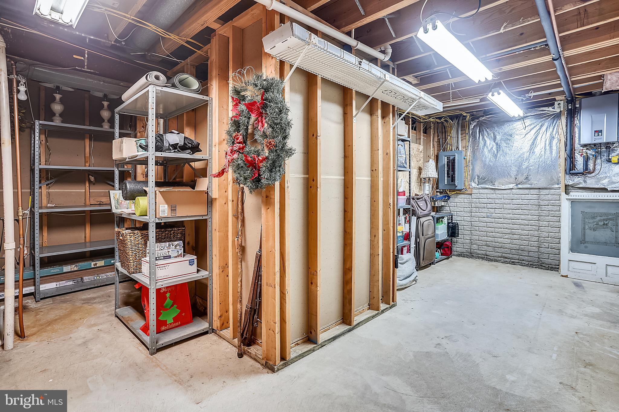 4522 Gilbertson Road Fairfax, VA 22032 - Photo 36 of 65 Tankless water heater in storage room.