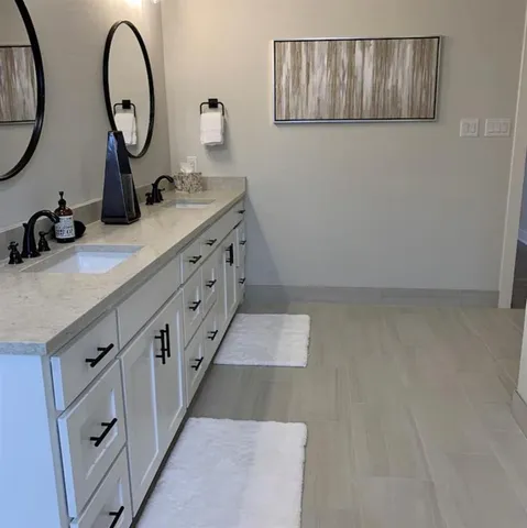 a bathroom with a bathtub and shower