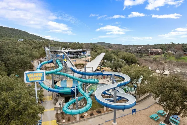 a view of a chairs and table in patio