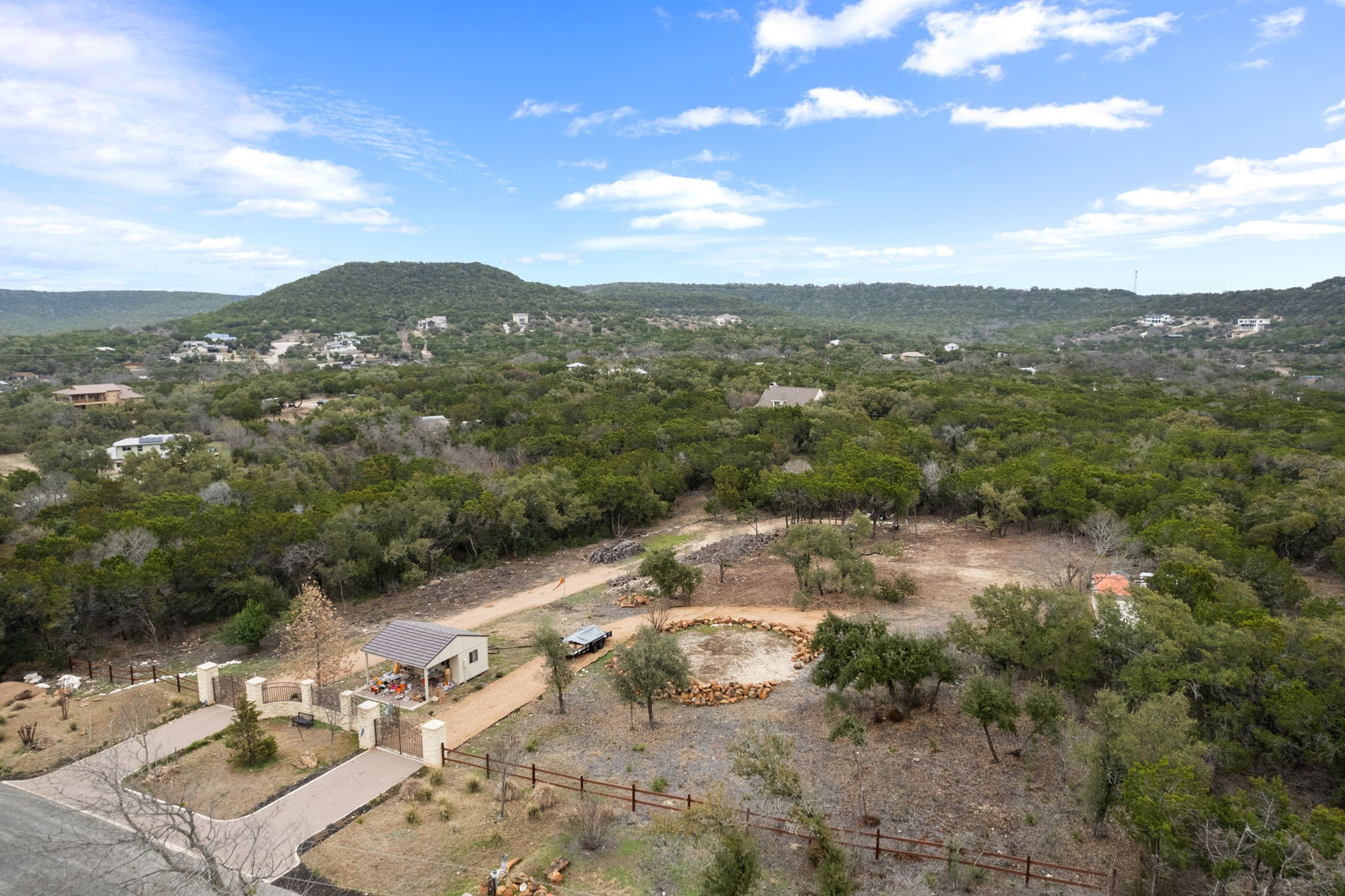 15902 Booth Circle Volente, TX 78641 - Photo 22 of 39 a view of a city with lush green forest