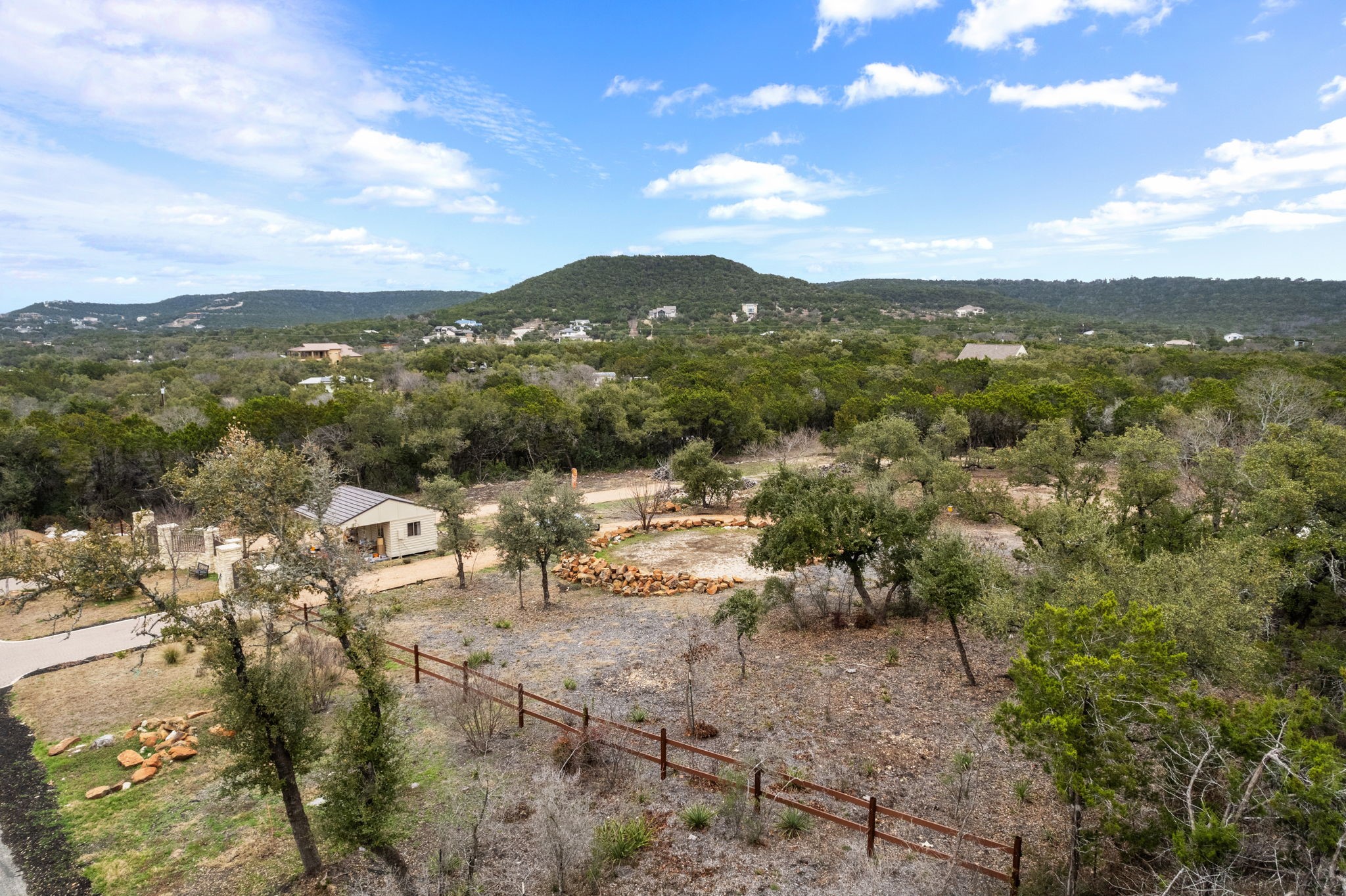15902 Booth Circle Volente, TX 78641 - Photo 35 of 39 a view of a lake with mountains in the background