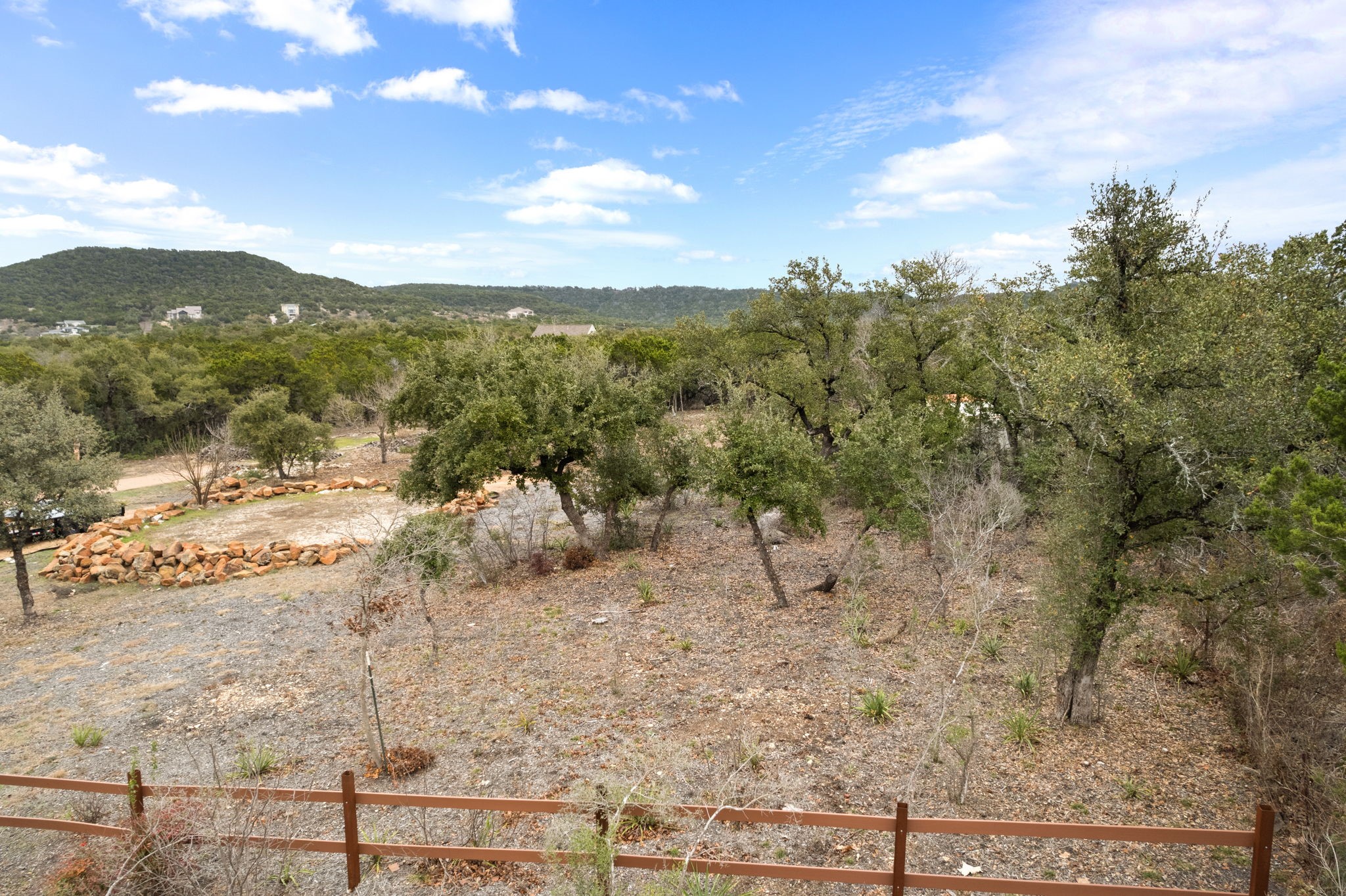 15902 Booth Circle Volente, TX 78641 - Photo 4 of 39 a view of a yard with mountains in the background