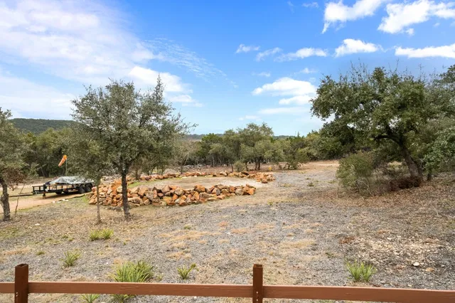 a view of a yard with snow on the road