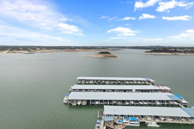 a view of a balcony with a table and chair