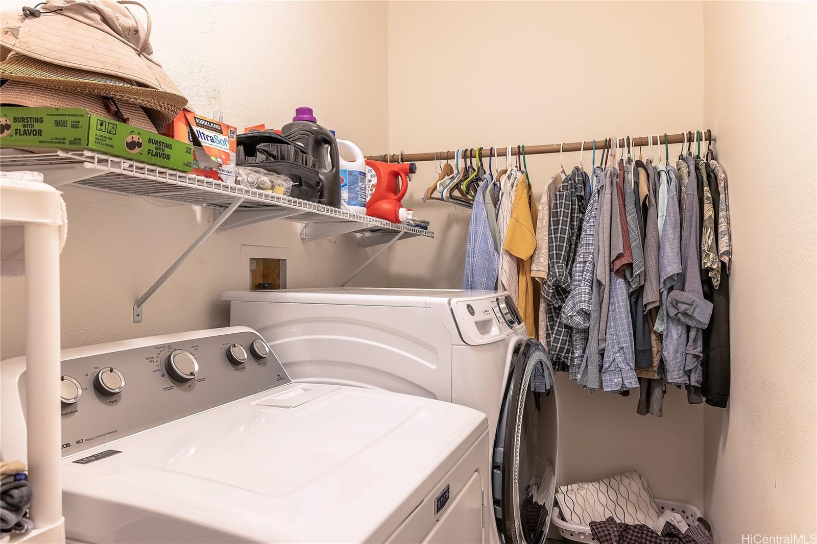 91-957 Laaulu Street, Unit 40F Ewa Beach, HI 96706 - Photo 16 of 22 a view of walk in closet with clothes and shoes
