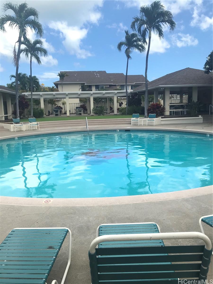 91-957 Laaulu Street, Unit 40F Ewa Beach, HI 96706 - Photo 20 of 22 a view of a lake from a yard