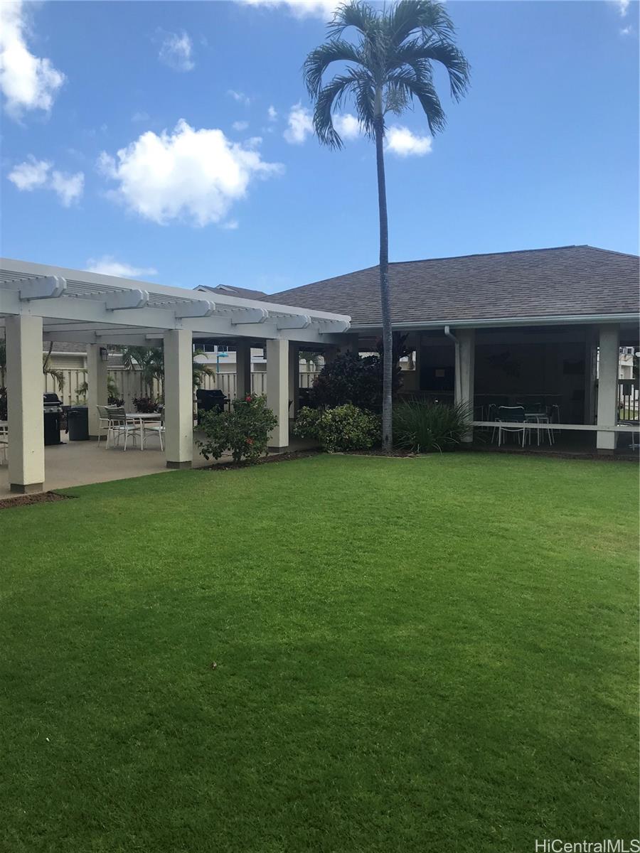 91-957 Laaulu Street, Unit 40F Ewa Beach, HI 96706 - Photo 22 of 22 a view of a house with a backyard