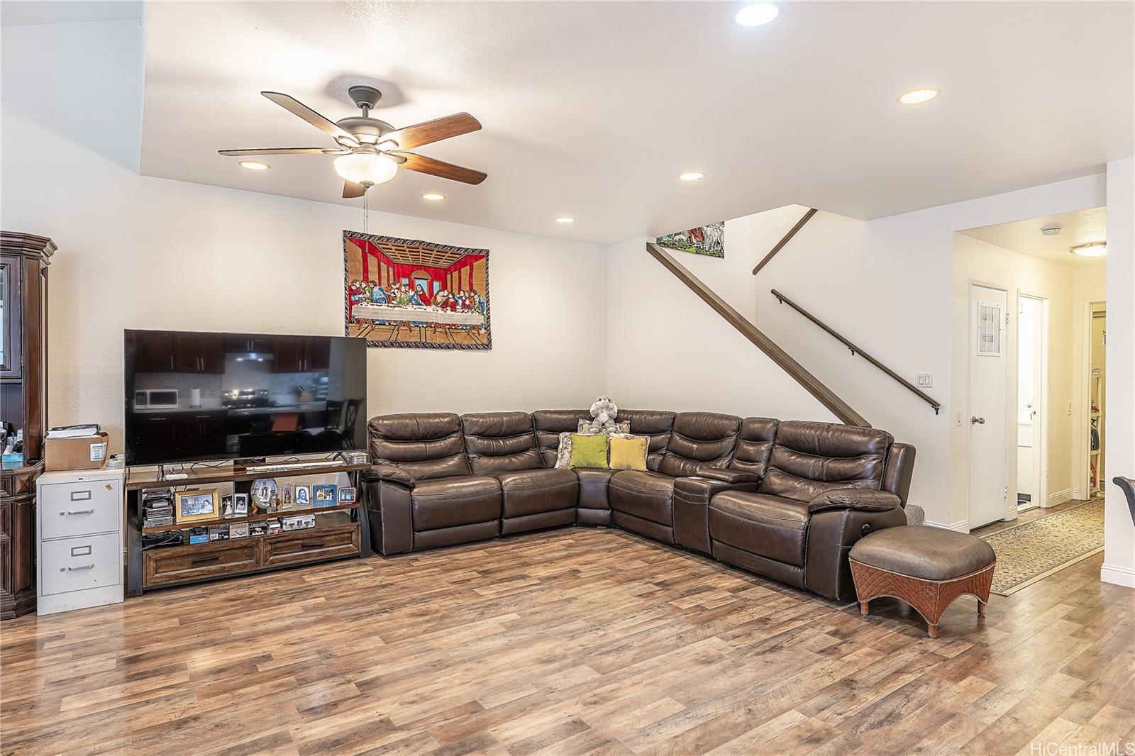 91-957 Laaulu Street, Unit 40F Ewa Beach, HI 96706 - Photo 6 of 22 a living room with furniture and a flat screen tv