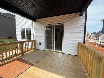 a view of a balcony with wooden floor