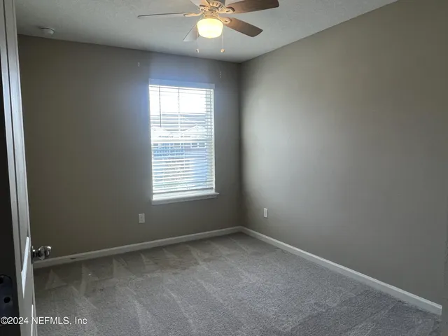 wooden floor and window in an empty room