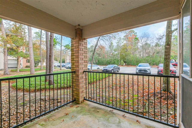 a view of a porch with a floor to ceiling window