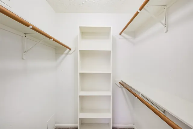 a view of an empty walk in closet