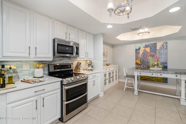 a kitchen with a stove and a microwave