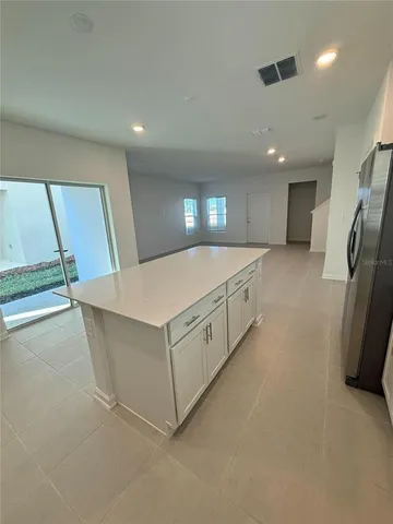 a kitchen with stainless steel appliances a refrigerator and a sink