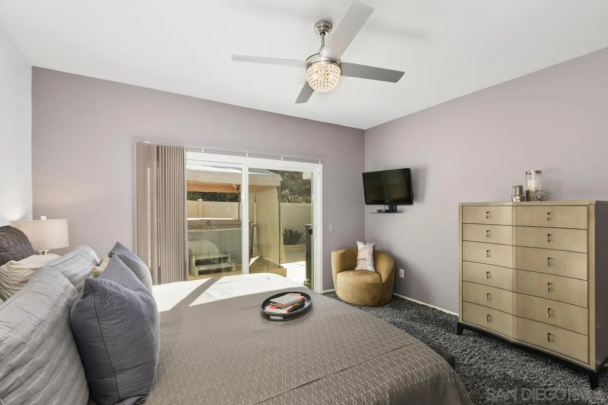 45627 Caminito Olite Temecula, CA 92592 - Photo 17 of 24 a bedroom with a bed and flat screen tv