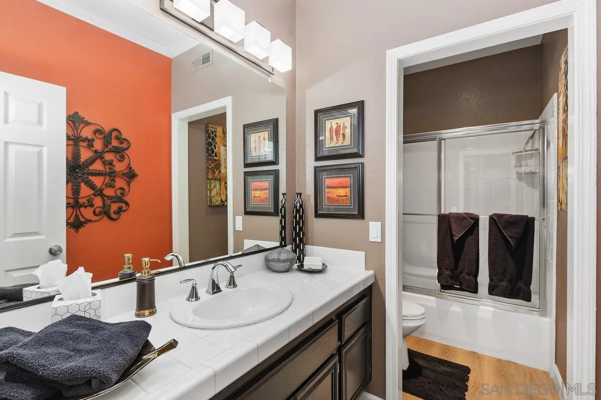 45627 Caminito Olite Temecula, CA 92592 - Photo 20 of 24 a bathroom with double vanity and a mirror