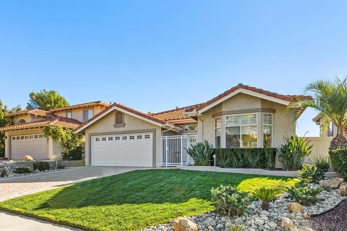 45627 Caminito Olite Temecula, CA 92592 - Photo 2 of 24 a front view of a house with garden