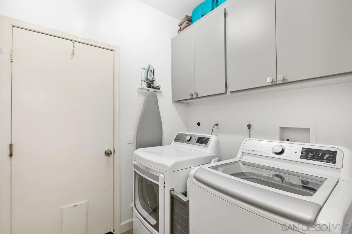 45627 Caminito Olite Temecula, CA 92592 - Photo 21 of 24 a utility room with dryer and washer